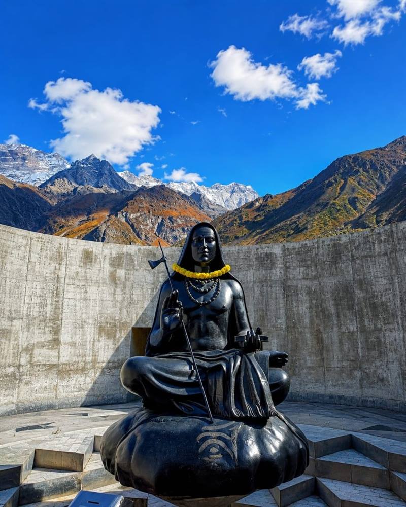 Adi Shankaracharya statue at Kedarnath with Himalayan mountains