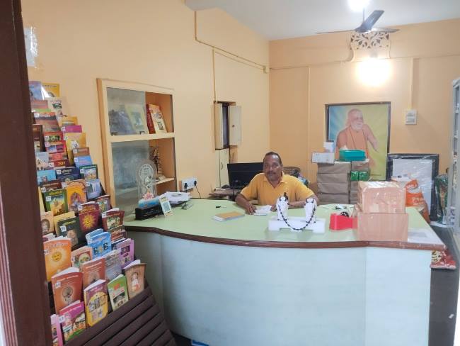 Interior of Swasti Prakashan — Reception desk with books on display